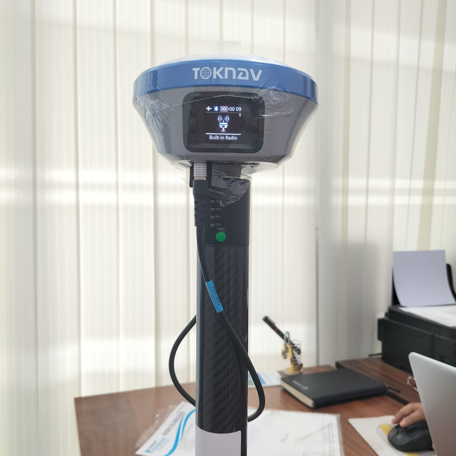 Surveyor using a theodolite